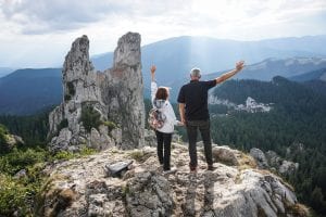 Elderly couple that have hiked to the top of a mountain in Kelowna